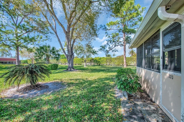 view of yard featuring a sunroom