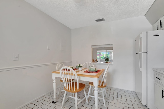 233 Down E Ln, Lake Worth, FL 33467 - dining area featuring a textured ceiling