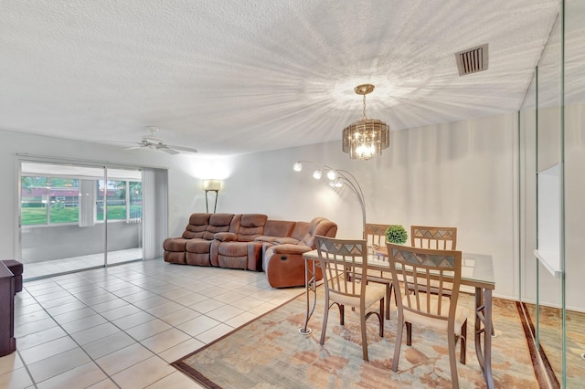233 Down E Ln, Lake Worth, FL 33467 - dining area featuring light tile patterned flooring, a chandelier, ceiling fan, and a textured ceiling