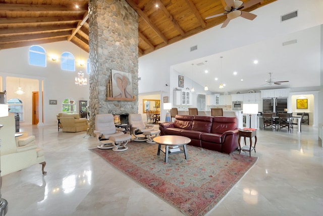 living room featuring wooden ceiling, visible vents, beam ceiling, and a stone fireplace