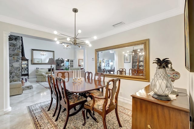 dining area featuring baseboards, visible vents, a notable chandelier, and ornamental molding