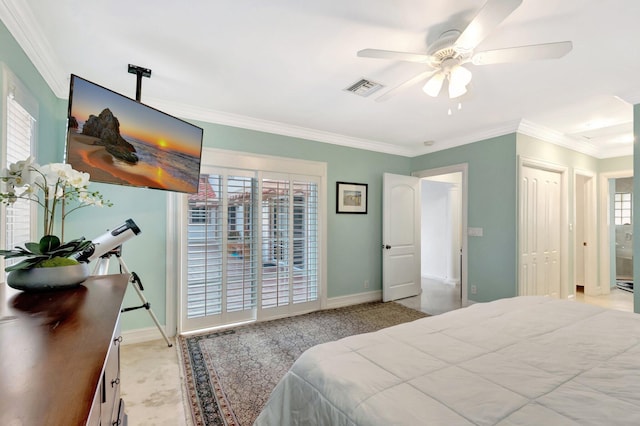 bedroom with visible vents, crown molding, baseboards, and ceiling fan