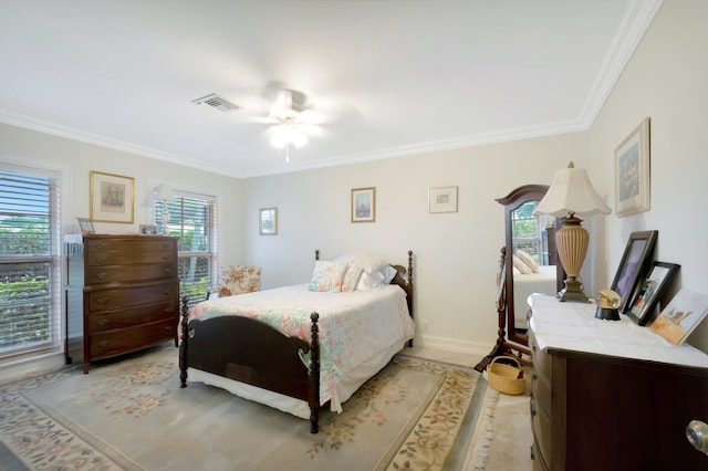 bedroom with a ceiling fan, visible vents, crown molding, and baseboards