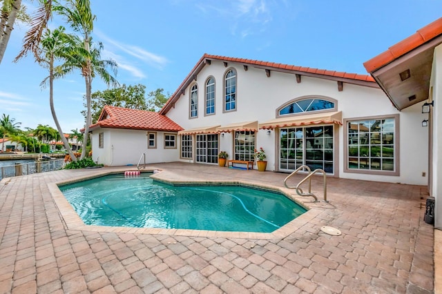 outdoor pool featuring a patio area