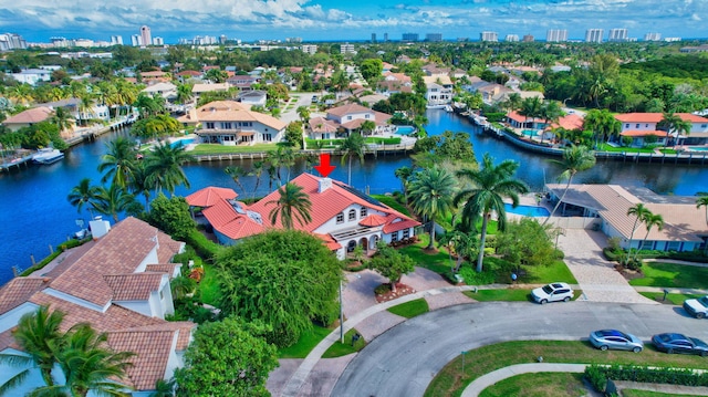 drone / aerial view with a residential view and a water view