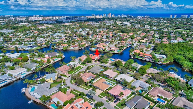 bird's eye view with a water view and a residential view