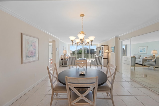 dining area featuring light tile patterned floors, crown molding, and an inviting chandelier