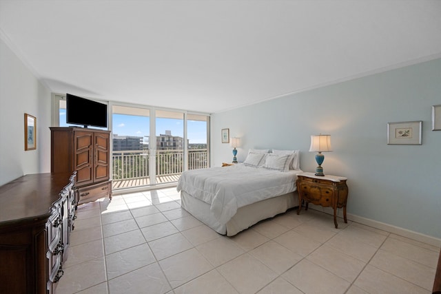 bedroom featuring a wall of windows, access to outside, crown molding, and light tile patterned floors