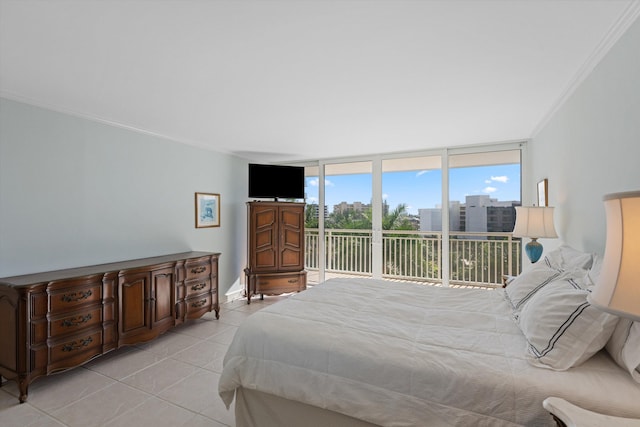 bedroom with access to exterior, floor to ceiling windows, crown molding, and light tile patterned flooring