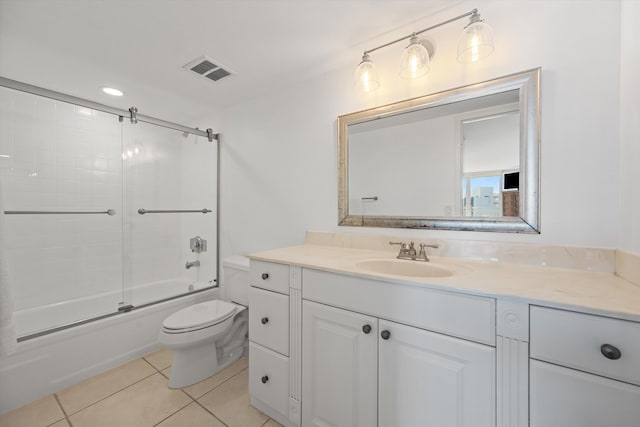 full bathroom with visible vents, toilet, enclosed tub / shower combo, tile patterned flooring, and vanity