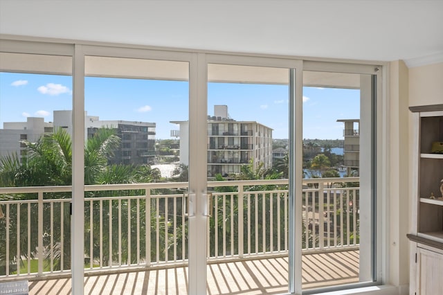 doorway featuring floor to ceiling windows and a city view