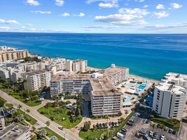 birds eye view of property featuring a water view and a city view