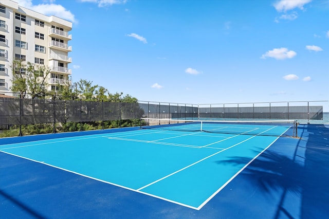 view of sport court with fence