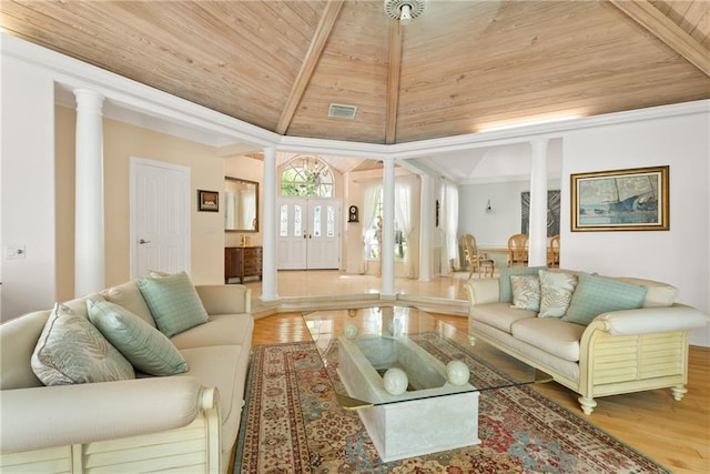 living room featuring decorative columns, visible vents, lofted ceiling with beams, wood ceiling, and wood finished floors