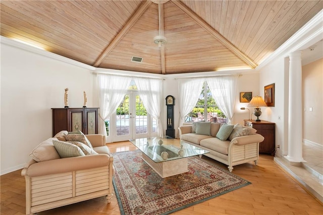 living area featuring wooden ceiling, visible vents, decorative columns, and wood finished floors