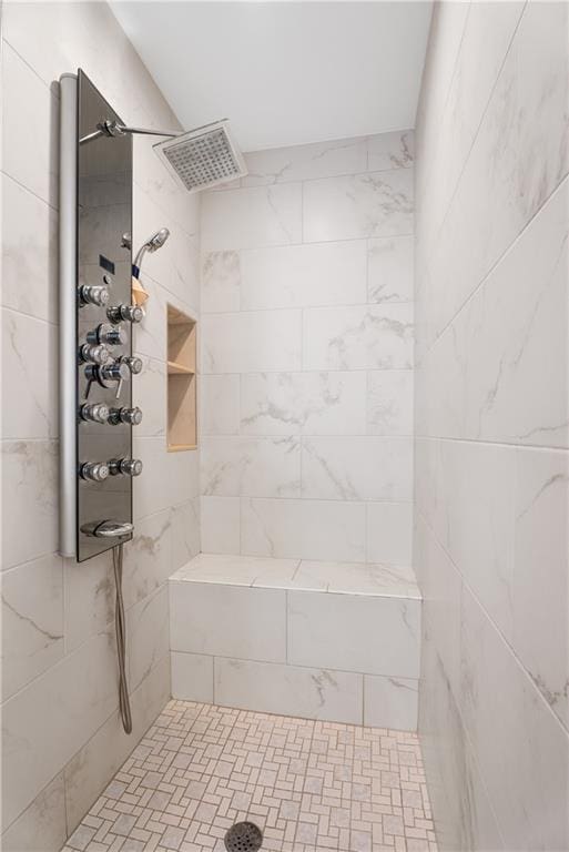 full bathroom with tiled shower