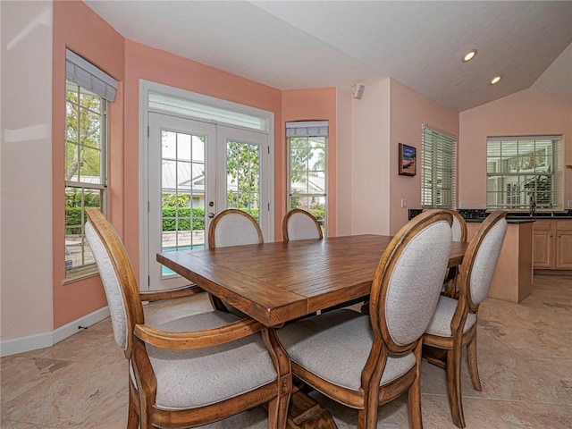 dining room with lofted ceiling, baseboards, french doors, and recessed lighting