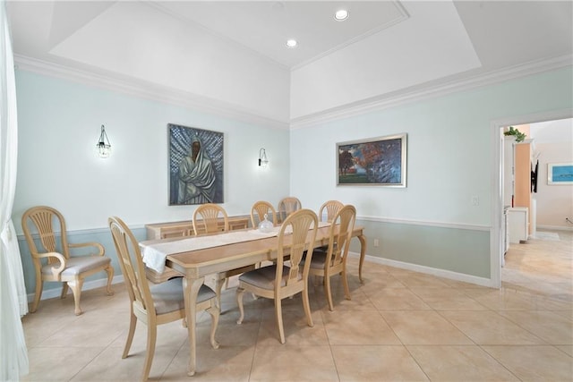 dining space featuring baseboards, a raised ceiling, light tile patterned flooring, crown molding, and recessed lighting