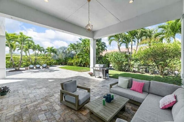 view of patio / terrace with an outdoor living space and grilling area