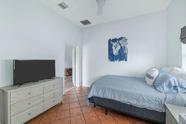 tiled bedroom featuring ceiling fan and visible vents