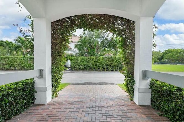 exterior space featuring decorative driveway