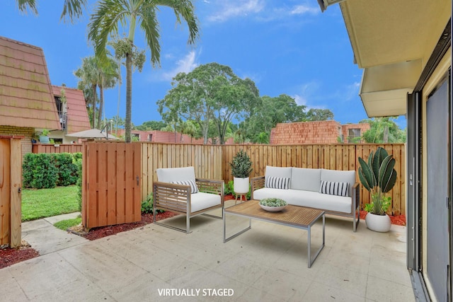 view of patio featuring outdoor lounge area and a fenced backyard