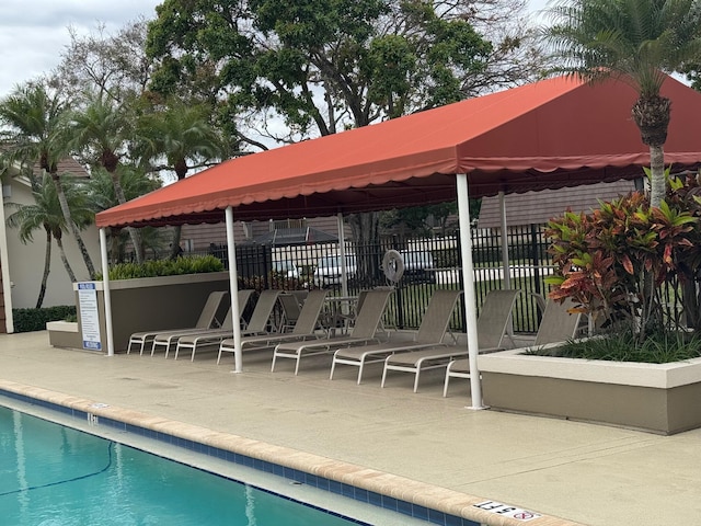 exterior space featuring fence, a gazebo, and a patio