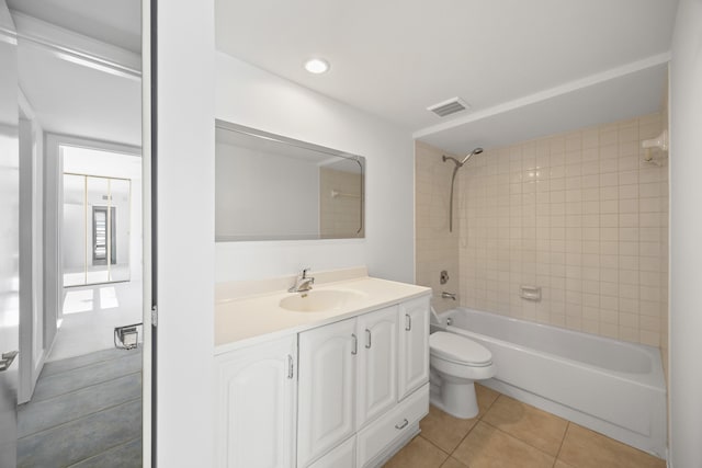 full bath with tile patterned flooring, toilet, shower / tub combination, vanity, and visible vents