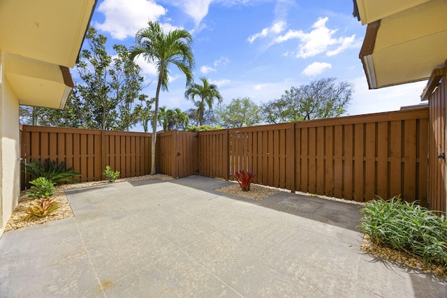 view of patio / terrace featuring a fenced backyard and a gate