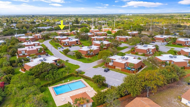 birds eye view of property with a residential view