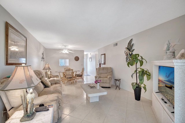 living room featuring visible vents, a ceiling fan, and light tile patterned flooring