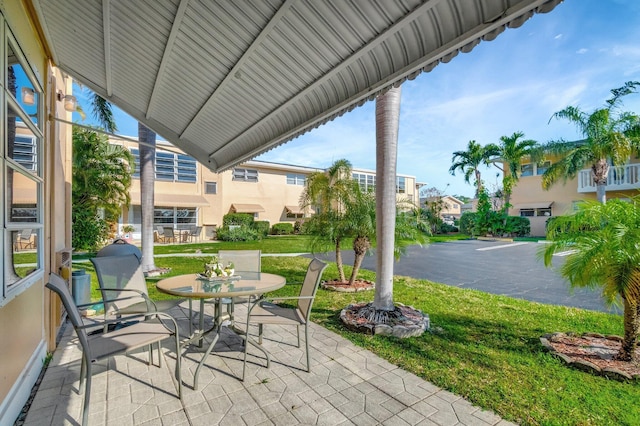 view of patio featuring outdoor dining area