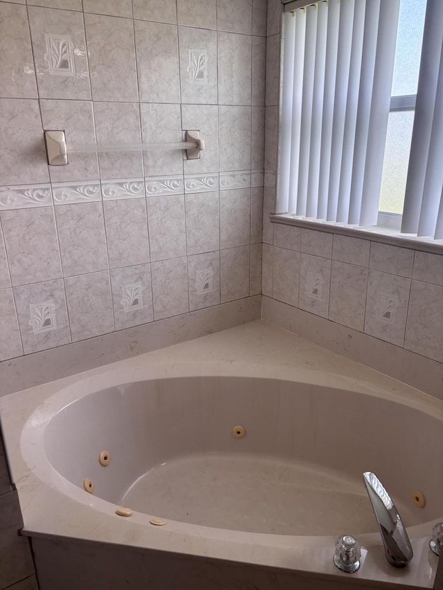 bathroom with a jetted tub