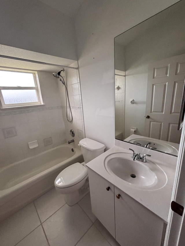 bathroom featuring tile patterned flooring, shower / tub combination, vanity, and toilet