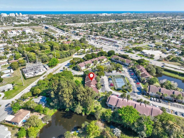 birds eye view of property featuring a water view