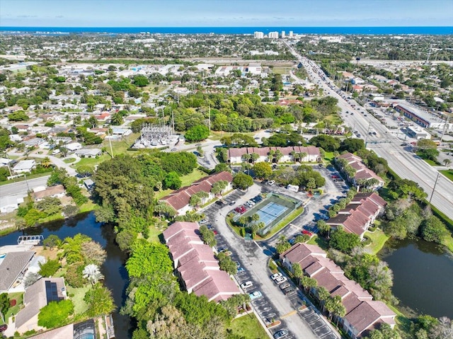 aerial view featuring a residential view and a water view