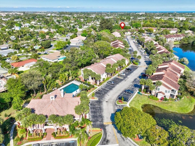 bird's eye view with a water view and a residential view