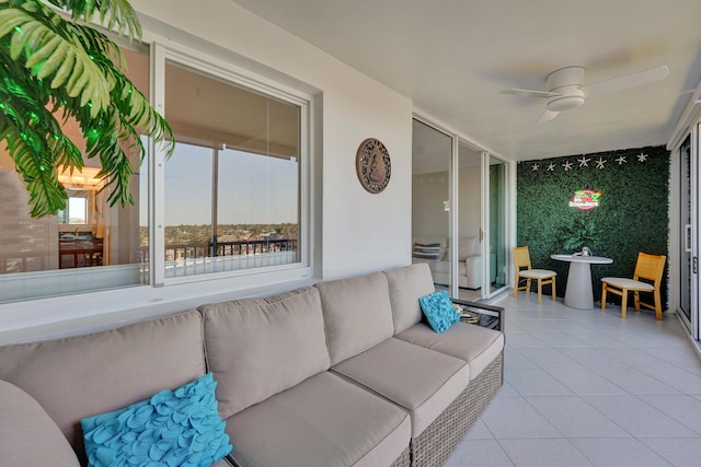 sunroom with a ceiling fan