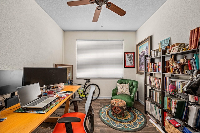 office with a textured ceiling, a textured wall, and ceiling fan