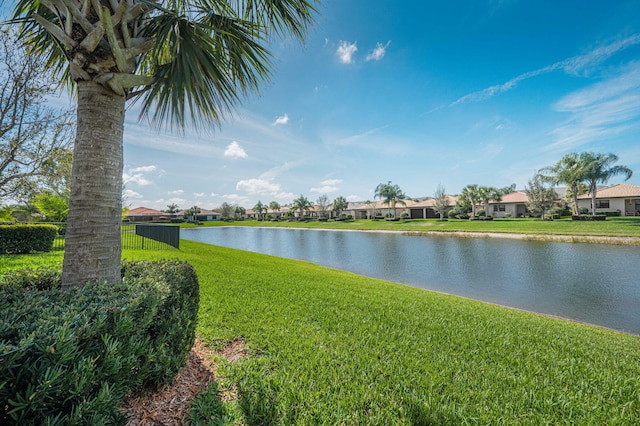 water view featuring a residential view and fence