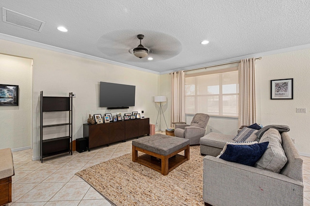 living area featuring a ceiling fan, a textured ceiling, visible vents, light tile patterned floors, and recessed lighting