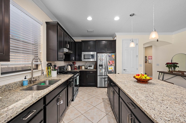 kitchen with visible vents, light stone countertops, arched walkways, a sink, and stainless steel appliances