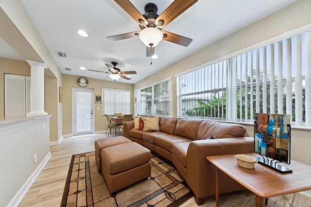 living room with recessed lighting, ornate columns, visible vents, light wood-style flooring, and baseboards