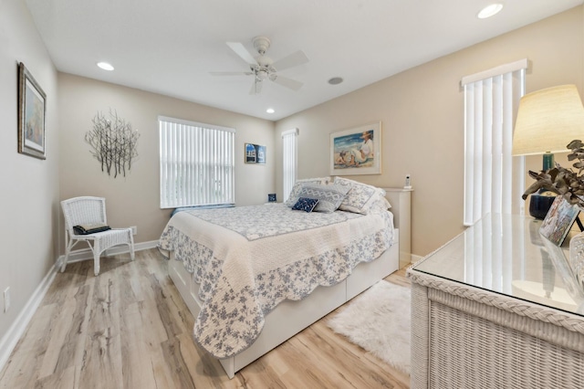 bedroom featuring light wood finished floors, recessed lighting, a ceiling fan, and baseboards