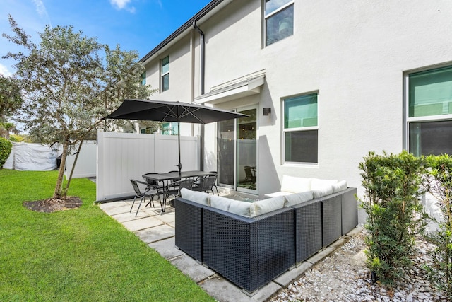 view of patio / terrace featuring outdoor lounge area and fence