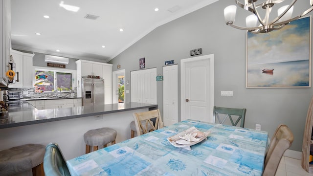 dining space featuring vaulted ceiling, ornamental molding, visible vents, and recessed lighting