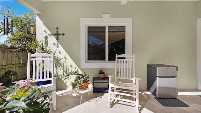 view of patio featuring fence