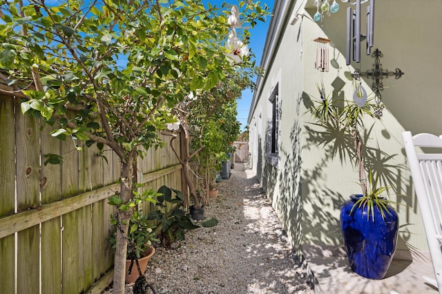 view of side of home featuring a fenced backyard