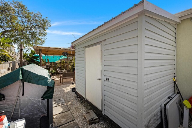 view of shed with fence