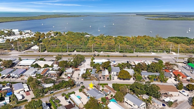 drone / aerial view featuring a water view and a residential view